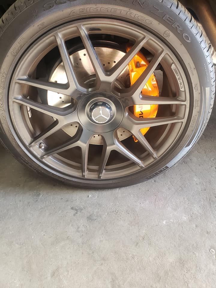 Refinished gunmetal wheel with orange caliper